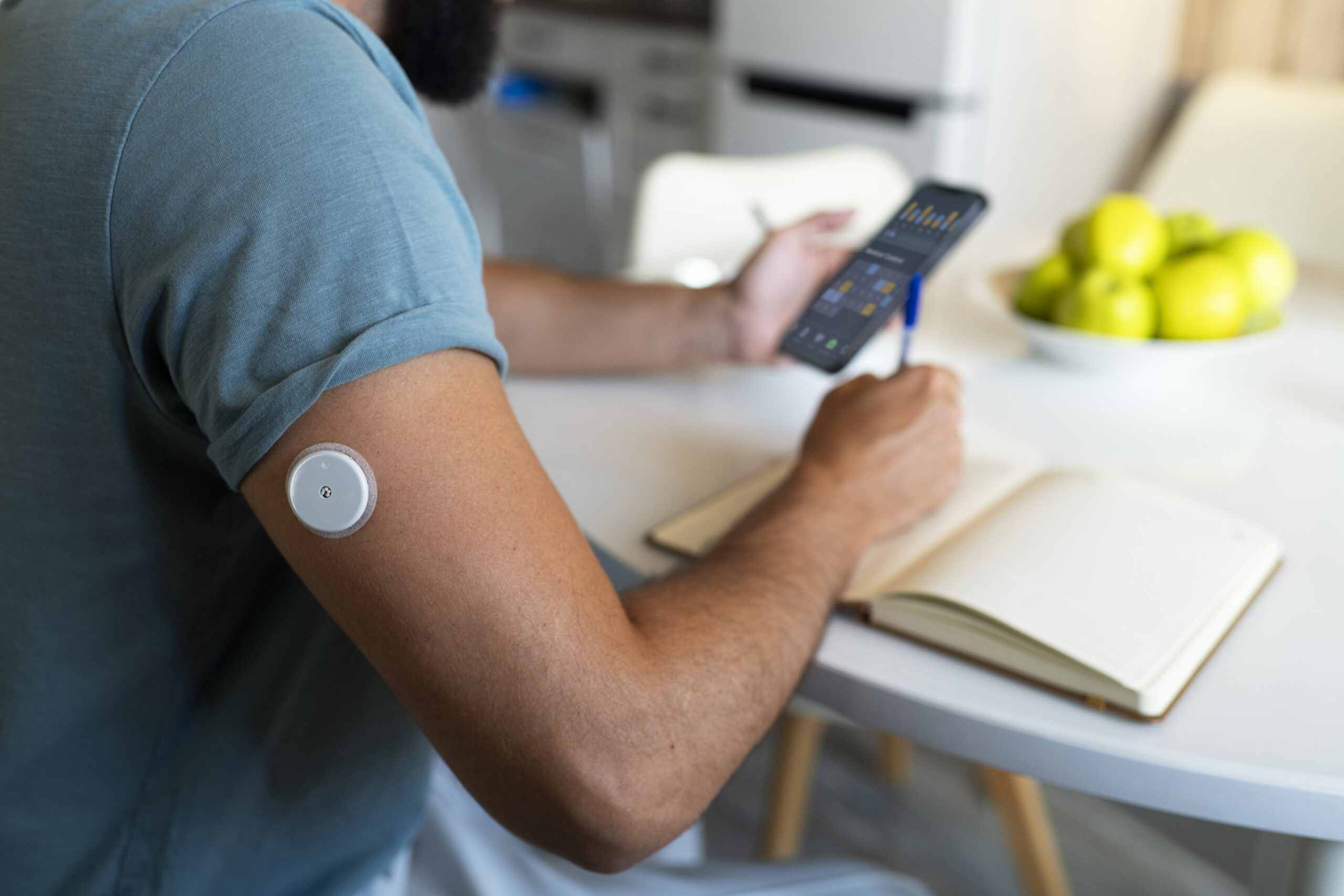 diabetic-man-checking-glucose-patch-sensor-scaled